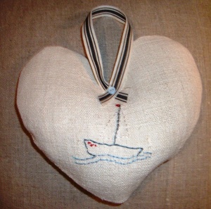 Embroidered boat on vintage linen